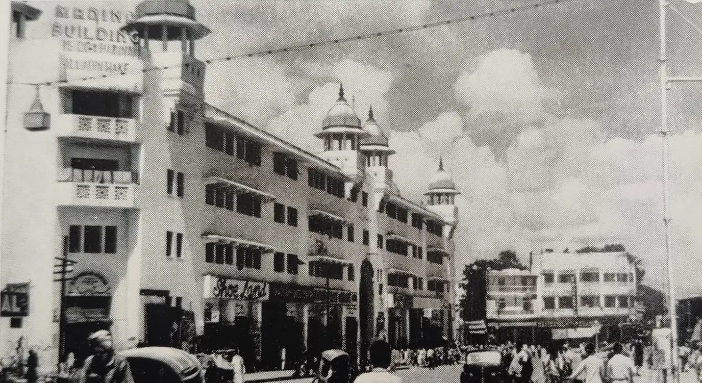 The Madina Building on Pathergatti Road, Old City Hyderabad — the 1947 premises of Madina Hotel, its domed turrets above the street