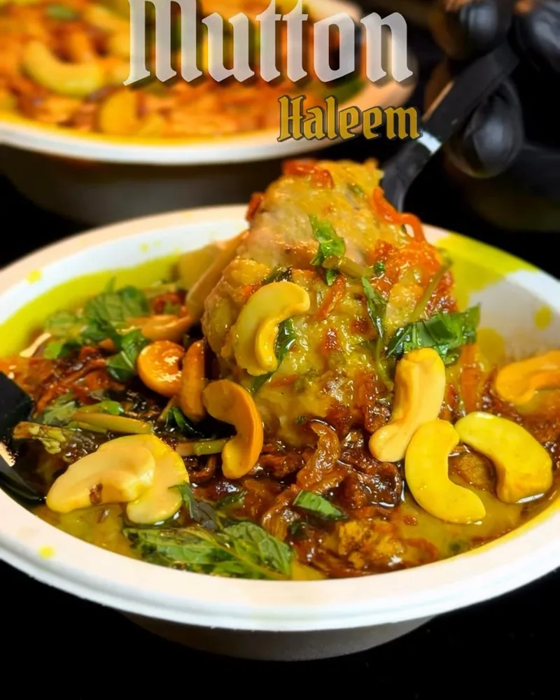 A bowl of Madina&rsquo;s mutton haleem topped with whole cashews, fried onion and fresh mint, captioned &ldquo;Mutton Haleem&rdquo;